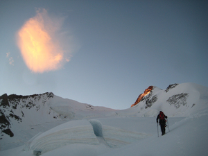 Cramponing up snow in the morning, roped up.